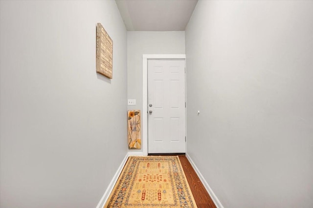 doorway with hardwood / wood-style floors