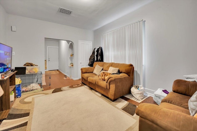 living room with light hardwood / wood-style flooring