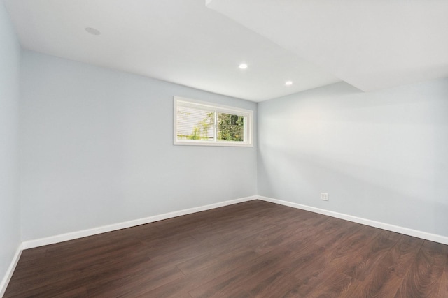 empty room featuring dark wood-type flooring