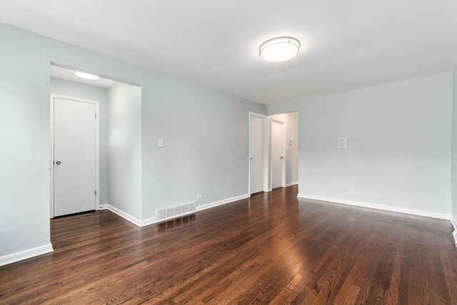 empty room featuring dark wood-type flooring