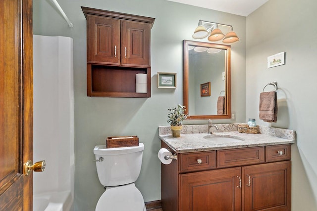 full bathroom featuring vanity,  shower combination, and toilet