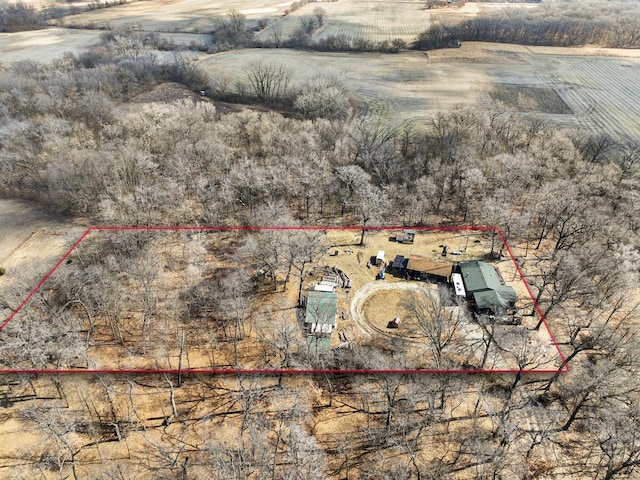 birds eye view of property with a rural view