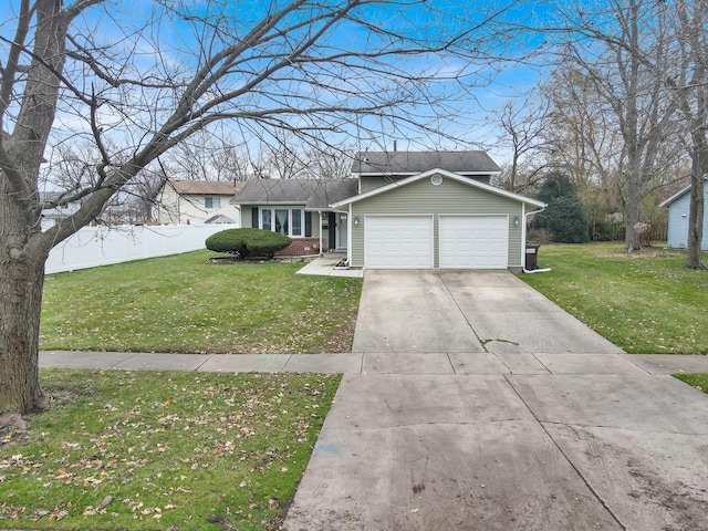 ranch-style house featuring a garage and a front lawn