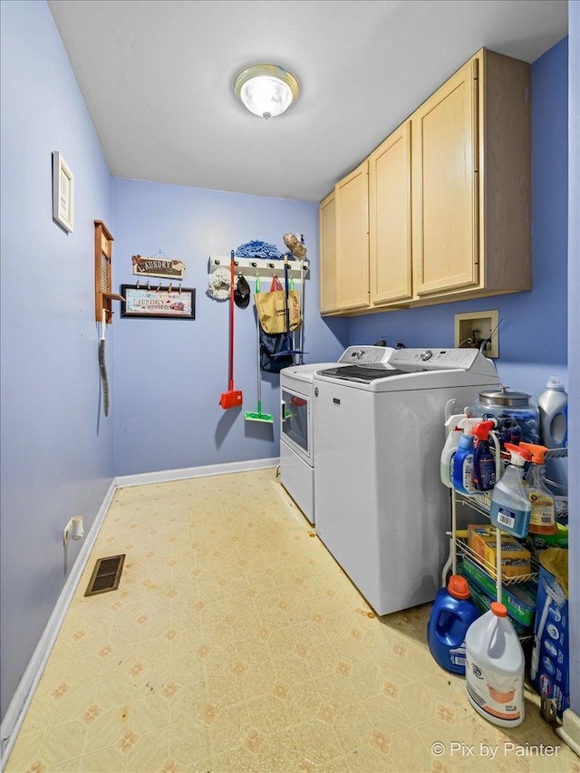 washroom with cabinets and separate washer and dryer