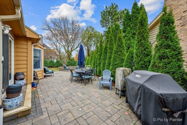 view of patio featuring a grill