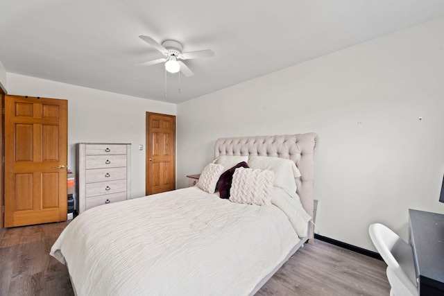 bedroom with hardwood / wood-style floors and ceiling fan