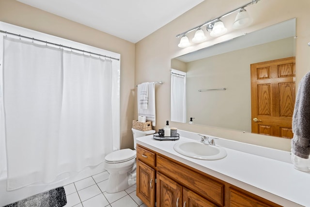 bathroom featuring tile patterned floors, toilet, curtained shower, and vanity