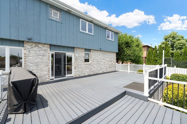 wooden terrace featuring area for grilling