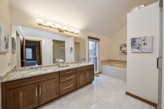 bathroom with tile patterned floors, separate shower and tub, vaulted ceiling, and vanity