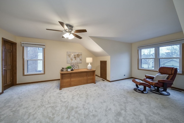 living area with lofted ceiling, light carpet, and ceiling fan