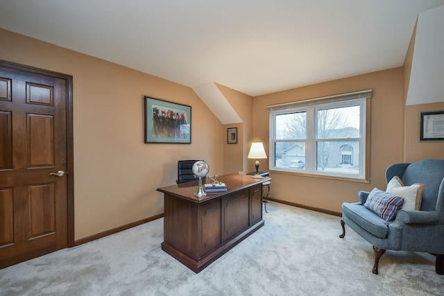 carpeted office space with lofted ceiling