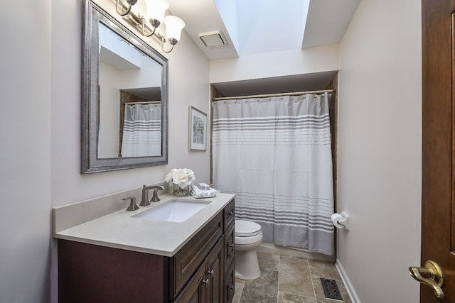 bathroom with vanity, walk in shower, and toilet