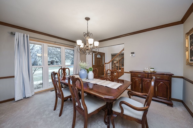 carpeted dining space featuring a notable chandelier and ornamental molding