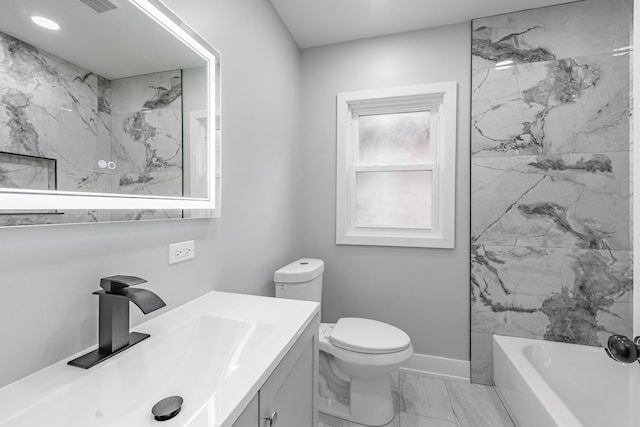 full bathroom featuring vanity, toilet, and tiled shower / bath combo