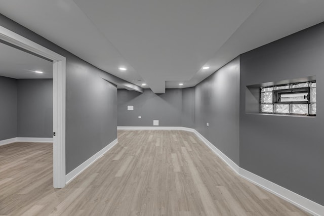 basement featuring light wood-type flooring