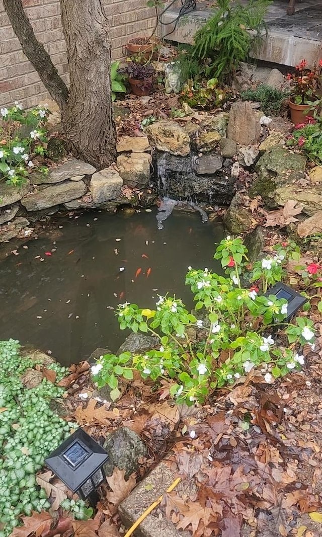 exterior details featuring a small pond