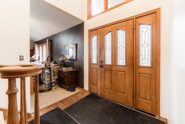 foyer entrance with vaulted ceiling