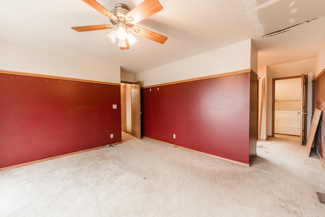 unfurnished room with carpet floors and ceiling fan