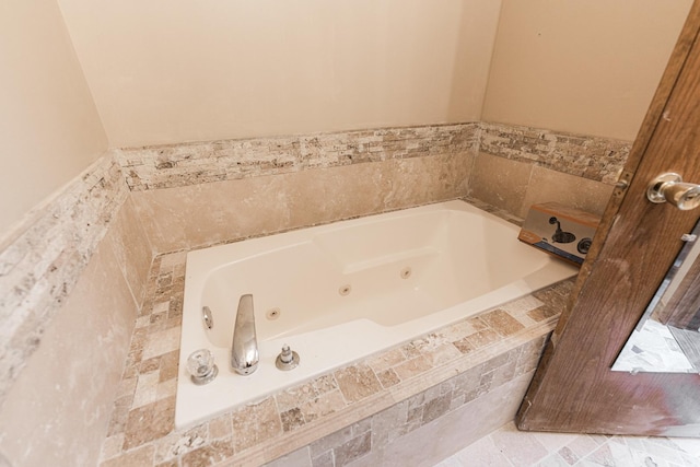 bathroom with a whirlpool tub