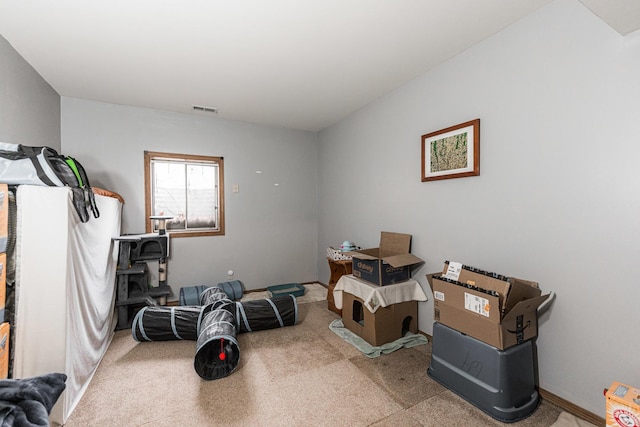 interior space with carpet floors and visible vents