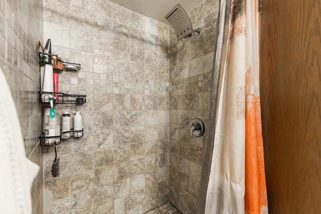 full bathroom with a tile shower