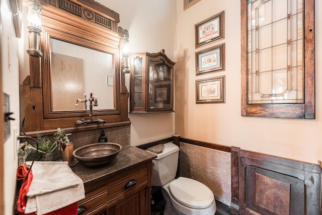 bathroom with toilet and vanity