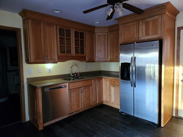 kitchen with stainless steel appliances, ceiling fan, sink, and dark hardwood / wood-style floors