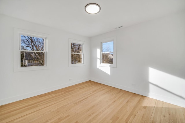 unfurnished room with light hardwood / wood-style flooring