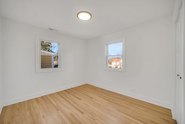 unfurnished room with plenty of natural light and light wood-type flooring