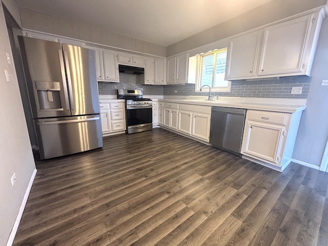 kitchen featuring stainless steel appliances, sink, and white cabinets