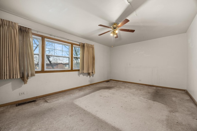 unfurnished room with light carpet and ceiling fan