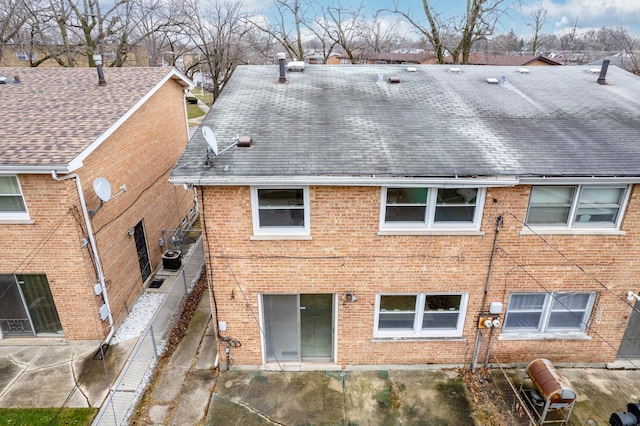 rear view of house with a patio