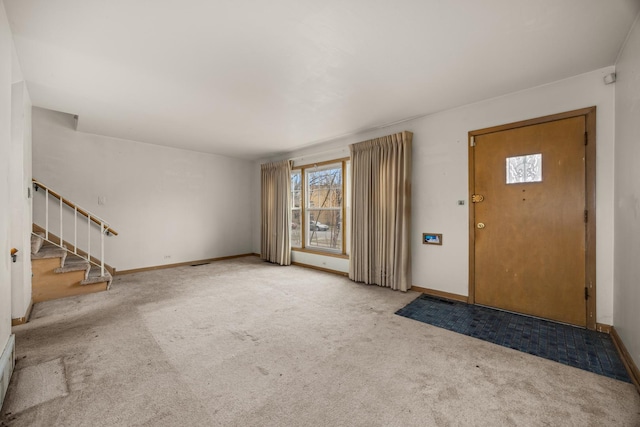 view of carpeted foyer