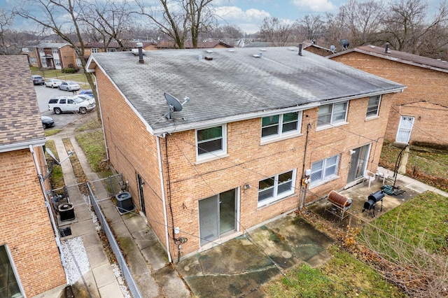 back of house featuring central AC and a patio area