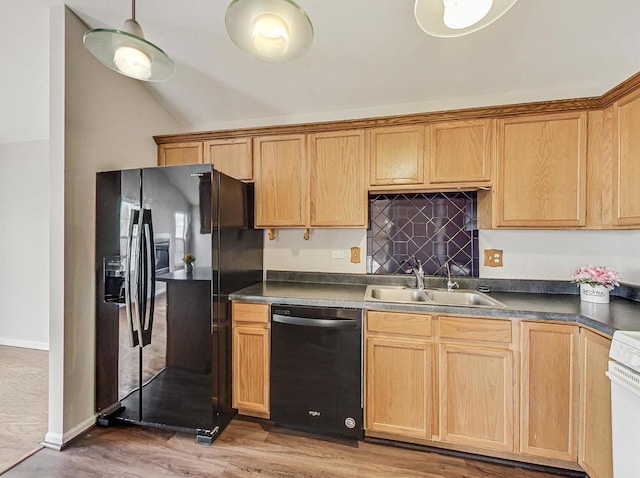 kitchen with sink, wood-type flooring, black appliances, and vaulted ceiling