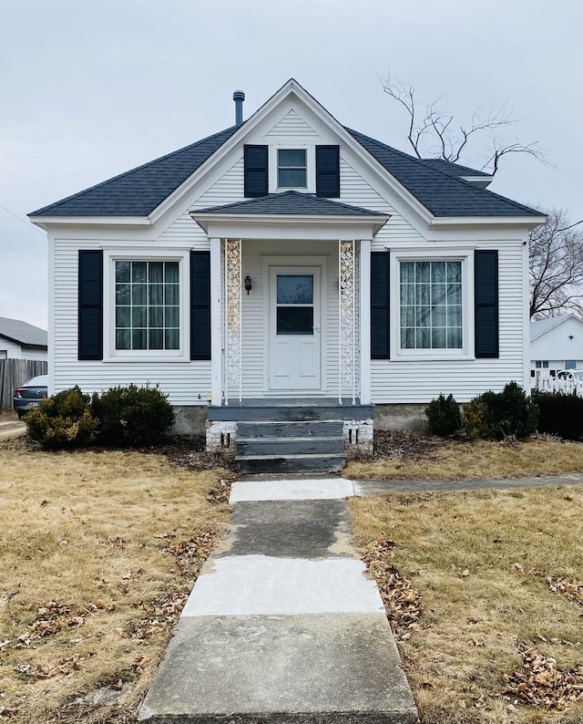 bungalow-style house featuring a front yard