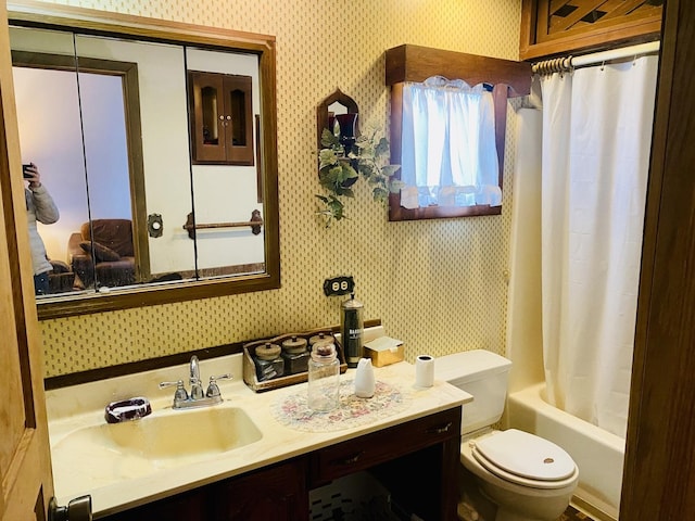 full bathroom with vanity, toilet, and shower / tub combo