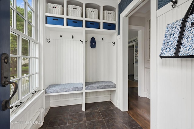 mudroom featuring dark tile patterned flooring