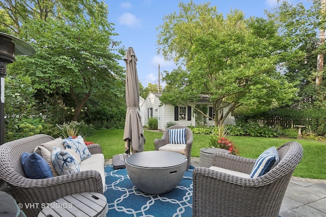 view of patio / terrace with an outdoor living space with a fire pit