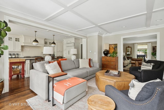 living room with ornamental molding, coffered ceiling, dark hardwood / wood-style flooring, and beam ceiling