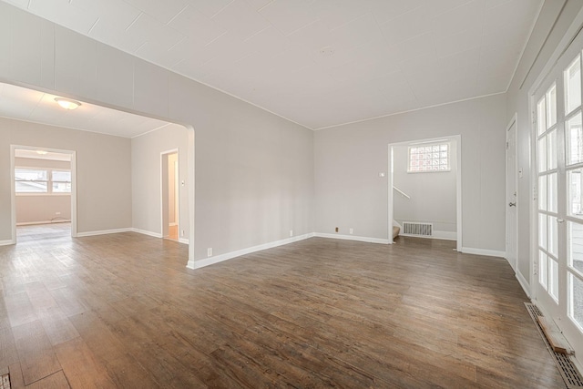 unfurnished room with dark hardwood / wood-style floors