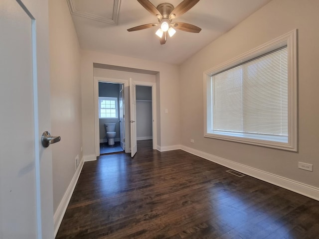 spare room with dark hardwood / wood-style floors and ceiling fan