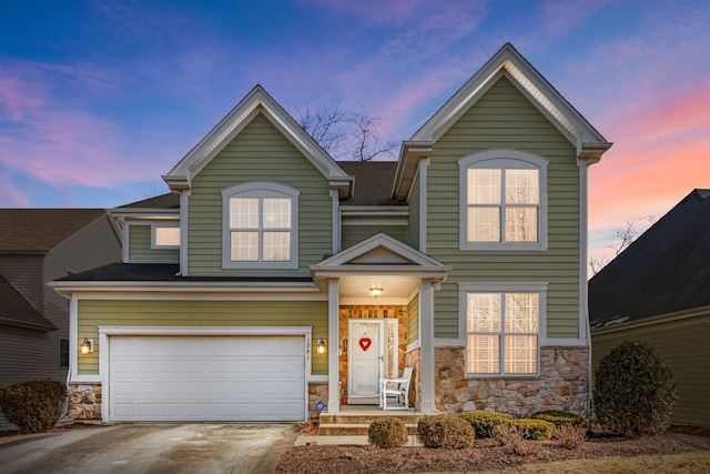 view of front of property with a garage