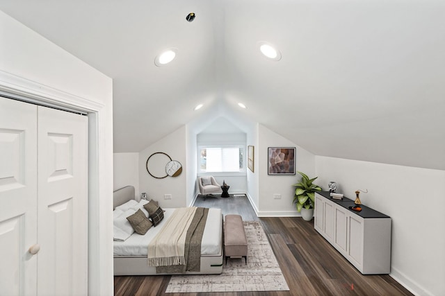 bedroom featuring dark wood-type flooring and vaulted ceiling