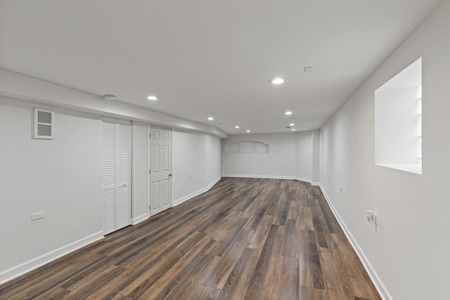 basement featuring dark hardwood / wood-style flooring