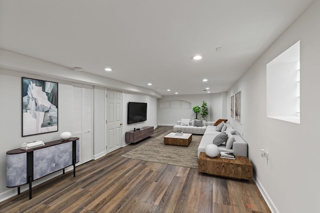 living room with dark hardwood / wood-style flooring