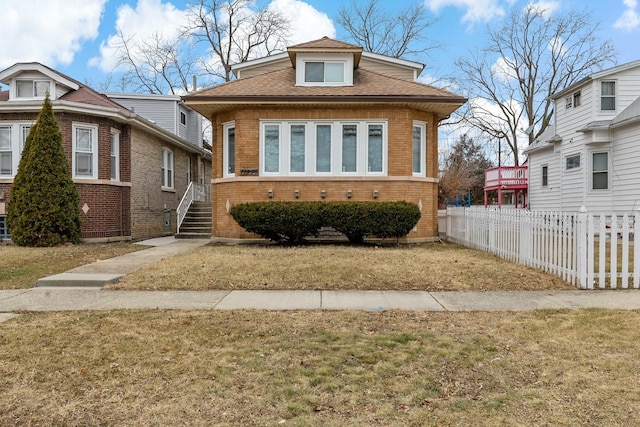 bungalow with a front yard