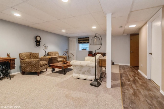 living room featuring a drop ceiling