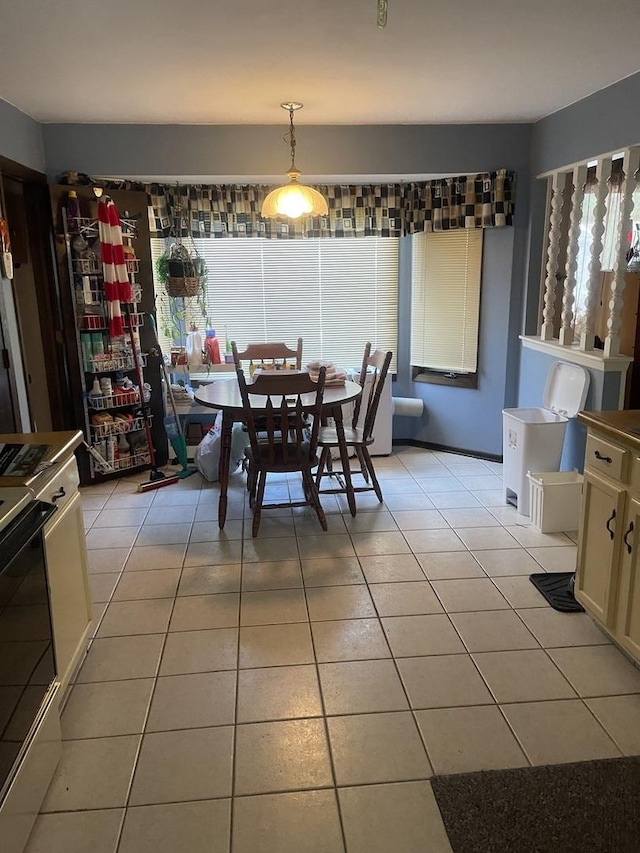 dining area featuring light tile patterned floors