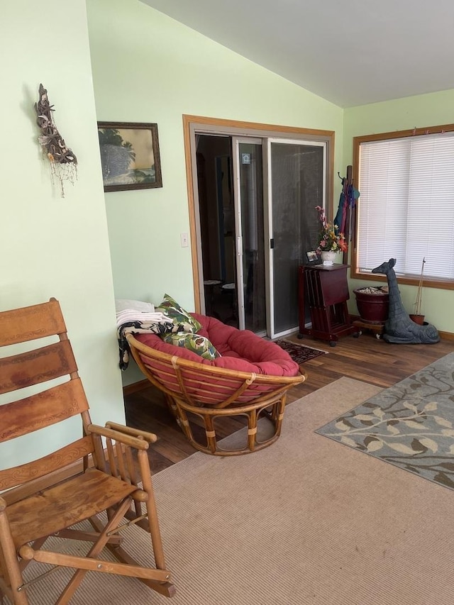 sunroom / solarium featuring lofted ceiling